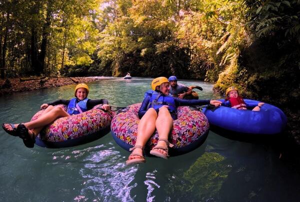 Family-friendly costa rica tubing adventure showing kids enjoying the safe and calm parts of the river.