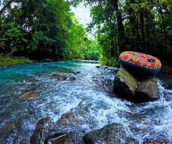 a rubber tube on a rock in a river