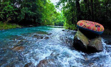 a rubber tube on a rock in a river