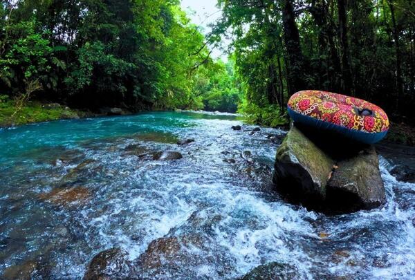 a rubber tube on a rock in a river