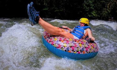 a person on a tube in the water