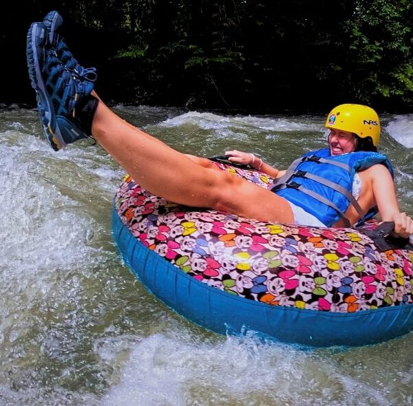 a person on a tube in the water